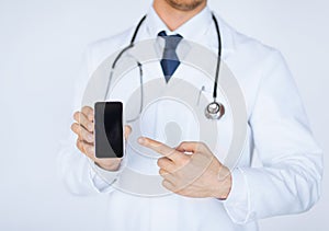 Doctor pointing at smartphone