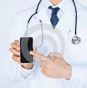 Doctor pointing at smartphone