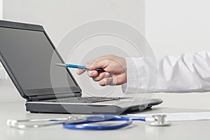 Doctor Pointing To The Computer Screen