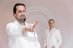 doctor points with a finger, space for interactive themes