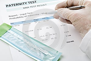 Doctor points at result on paternity test result form