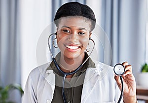Doctor, portrait and black woman with stethoscope for heartbeat, healthcare services and cardiology. Face, African