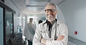 Doctor in portrait, senior man with arms crossed and healthcare, smile with confidence at hospital with pride and help