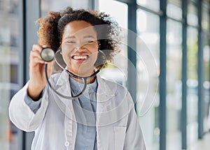 Doctor, portrait and woman listening with stethoscope for heartbeat, healthcare and cardiology. Happy black female