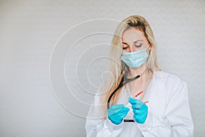 Doctor posing with syringes for diabetes mellitus people on a white background. Copy space