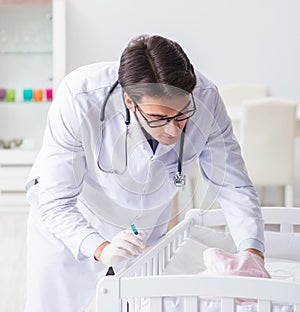 The doctor preparing for baby vaccination