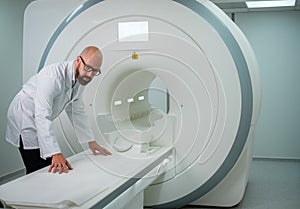 Doctor preparing MRI scanner in a hospital