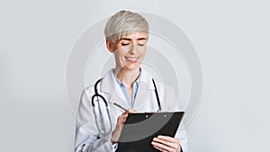 Doctor prescribe medication. Smiling woman in uniform photo
