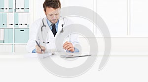 Doctor prescribes prescription sitting at the desk medical office, isolated on white, copy space and web banner photo