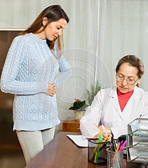 Doctor prescribes treatment for a patient