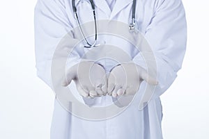 A Doctor presenting blank palm of hand holding something.