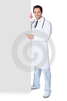 Doctor presenting empty banner