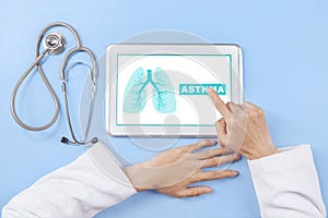 Doctor presses a tablet screen with lungs symbol