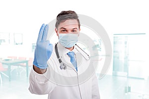 Doctor proctologist wearing white medical uniform photo