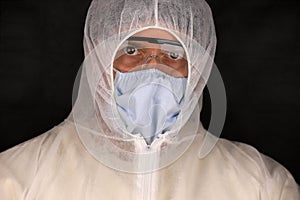 Doctor in a protective suit and mask during a rapidly spreading coronavirus. Global coronavirus disease COVID-19 2020