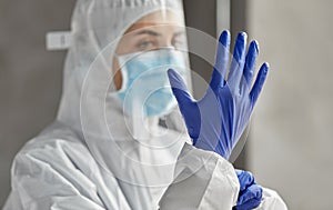 Doctor in protective wear, mask and face shield
