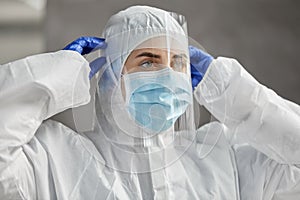 Doctor in protective wear, mask and face shield