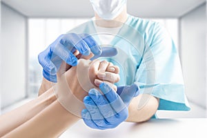 The doctor protects the patient`s hand with his own hands. Medical concept. Insurance