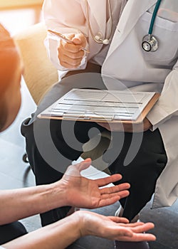 Doctor or psychiatrist consulting and diagnostic examining stressful woman patient on obstetric - gynecological female illness photo