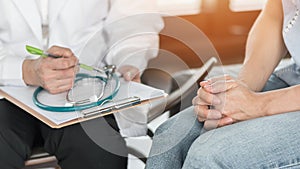 Doctor or psychiatrist consulting and diagnostic examining stressful woman patient on obstetric - gynecological female illness photo