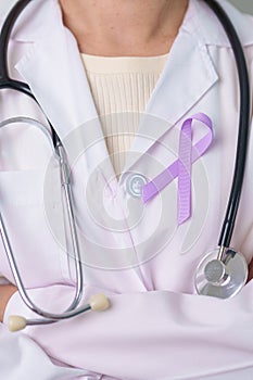 Doctor with purple ribbon for world cancer day, lupus, Pancreatic, Esophageal, Testicular cancer, world Alzheimer, epilepsy,