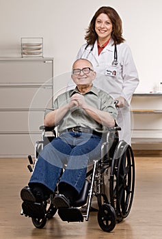 Doctor pushing disabled patient in wheel chair