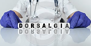 The doctor put together a word from cubes DORSALGIA