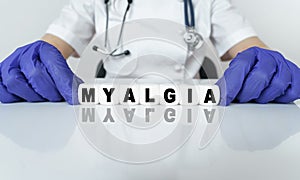 The doctor put together a word from cubes MYALGIA