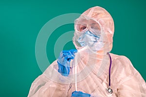 A doctor puts on a PPE suit uniform with a stethoscope on the shoulder, wearing a medical protective Mask and glasses on the face