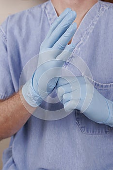 Doctor Putting on Latex Gloves