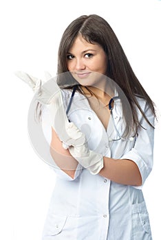 Doctor putting on sterile gloves