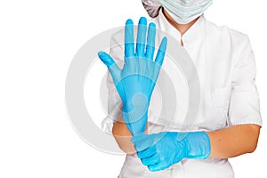 Doctor putting on sterile gloves isolated on white. Medical advertising concept.
