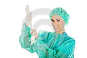 Doctor putting sterilized medical glove.