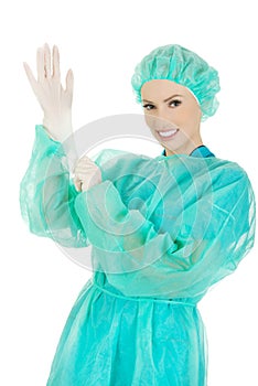 Doctor putting sterilized medical glove.