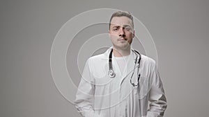 Doctor putting on stethoscope