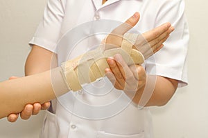 Doctor putting wrist brace