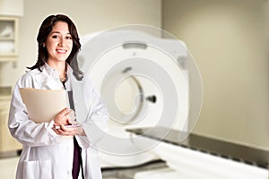 Doctor radiologist at CT CAT scan with chart photo