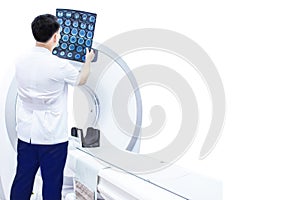 Doctor or radiologist holding Film CT scan image of the brain.