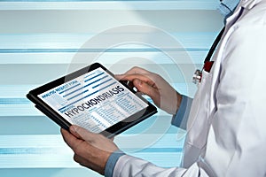 Doctor reading hypochondriasis diagnosis in digital medical repo