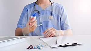 Doctor reading medicine label to prescribe the patient.