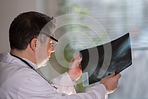 Doctor reading X-ray images