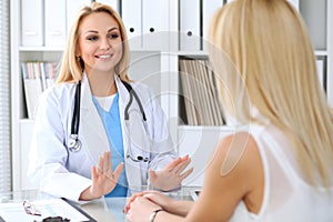 Doctor reassuring her female patient. Medicine, help and health care concept