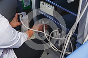 The doctor reconnect the ultrasound sensor photo