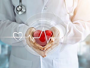 Doctor with red heart shape and icon heartbeat