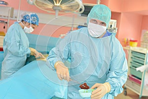 Doctor removing organ from patient