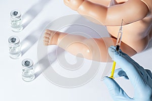 Doctor  researcher holds hands syringe in blue glove holding flu  measles  rubella or hpv vaccine and syringe with needle