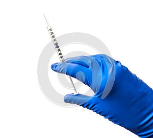 Doctor`s hand in blue medical glove holding open syringe with medical solution isolated white background. Flu vaccine