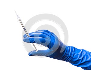 Doctor`s hand in blue medical glove holding open syringe with medical solution isolated white background. Flu vaccine