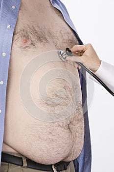 Doctor's Hand Examining Obese Man