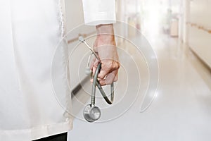 Doctor`s hand holding stethoscope